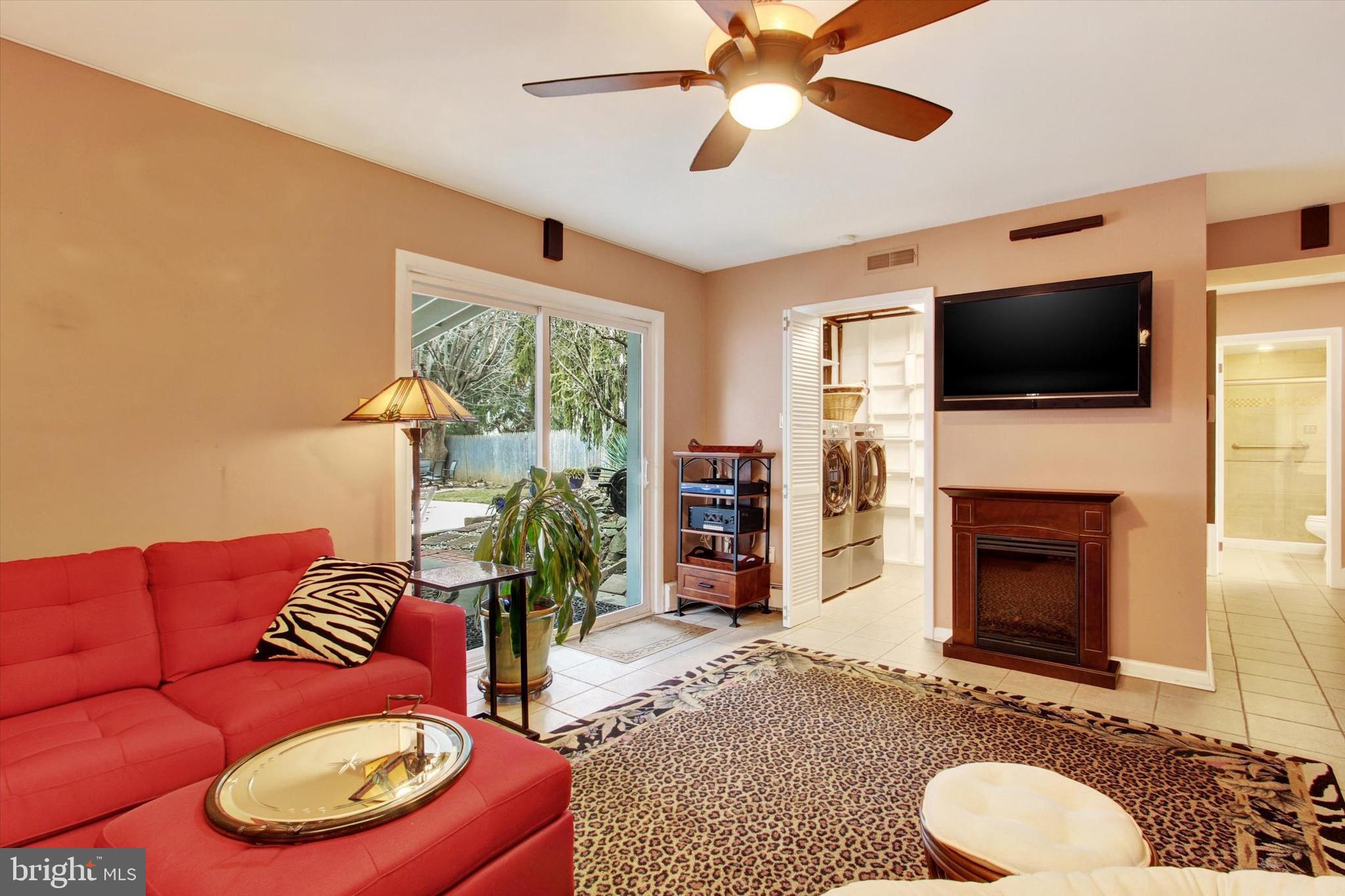 428 George Street Hanover, PA 17331 - Photo 30 of 43 a living room with furniture a flat screen tv and a fireplace