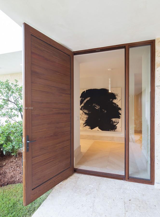 4550 Bay Point Road Miami, FL 33137 - Photo 15 of 92 a view of a glass door and a window