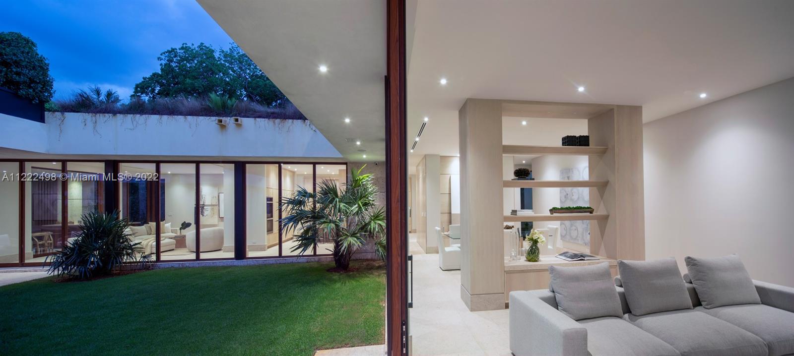 4550 Bay Point Road Miami, FL 33137 - Photo 23 of 92 a view of a livingroom with furniture and garden