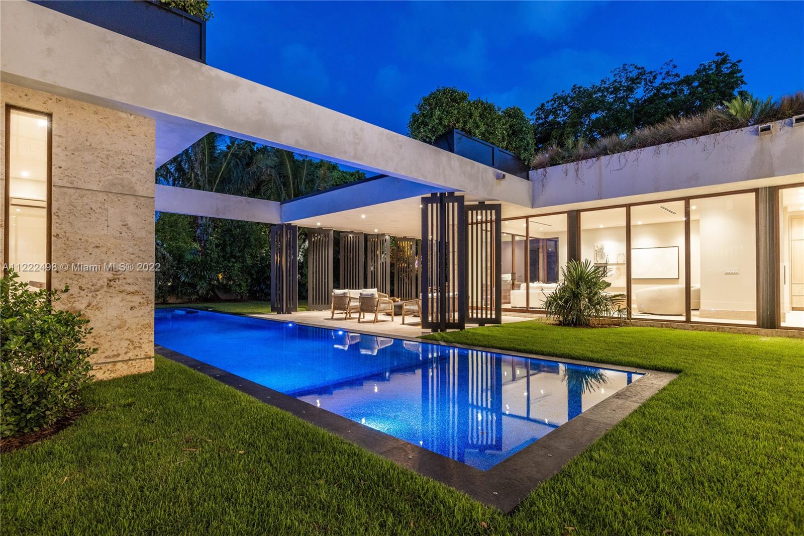 4550 Bay Point Road Miami, FL 33137 - Photo 25 of 92 a view of swimming pool with outdoor seating