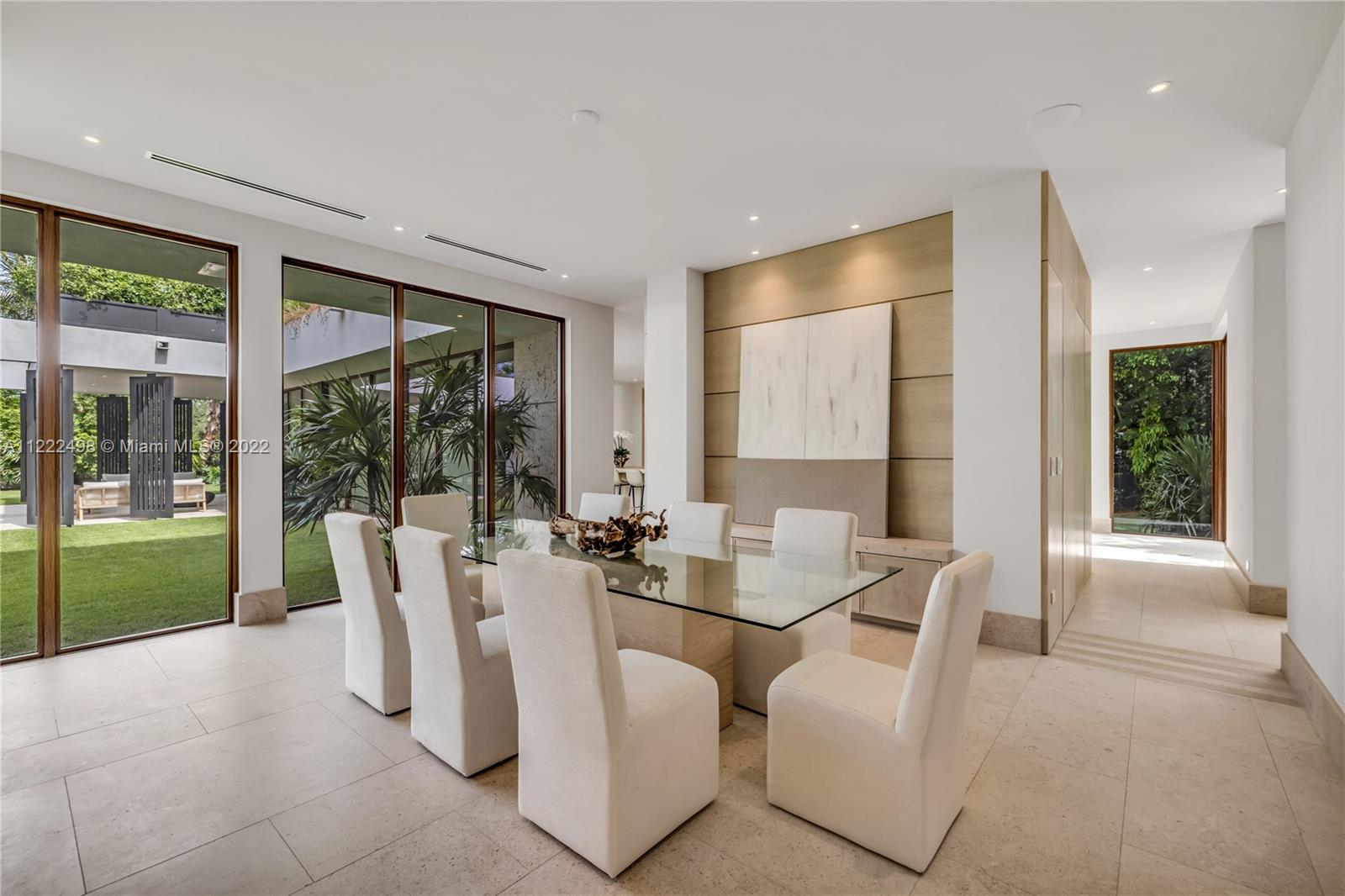 4550 Bay Point Road Miami, FL 33137 - Photo 27 of 92 a dining room with furniture and a large window