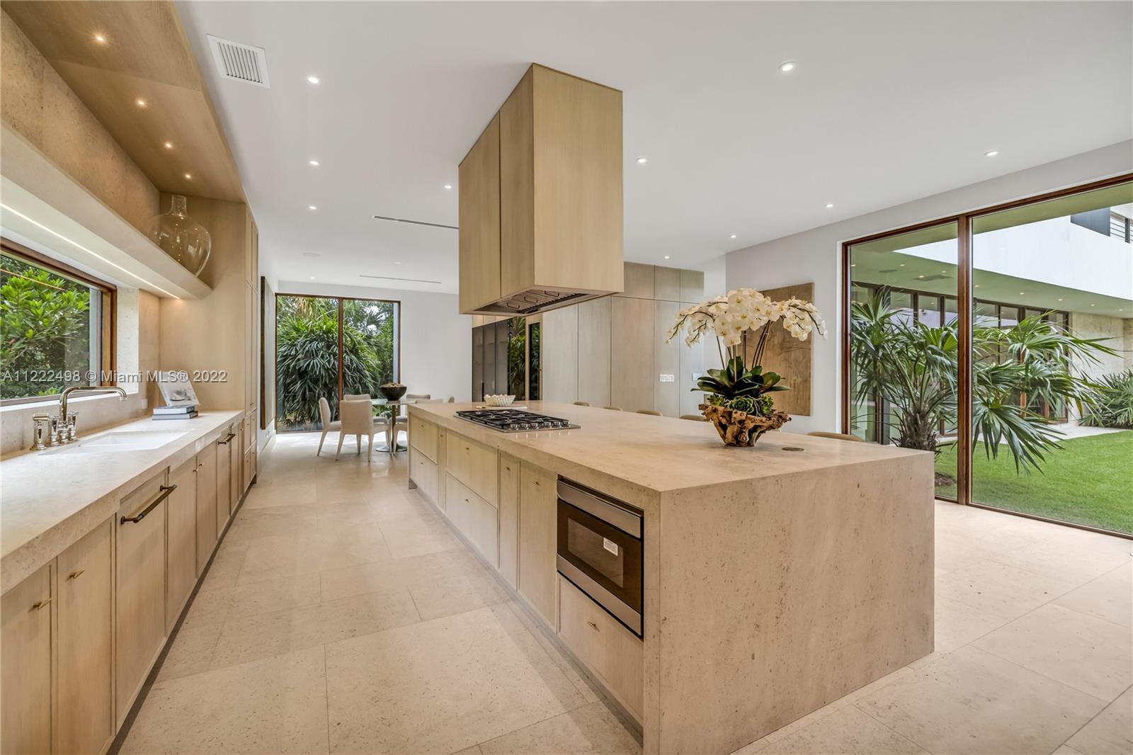 4550 Bay Point Road Miami, FL 33137 - Photo 33 of 92 a large kitchen with stainless steel appliances granite countertop a large counter top a stove and a sink