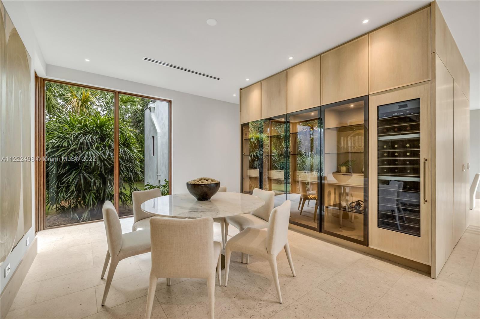 4550 Bay Point Road Miami, FL 33137 - Photo 35 of 92 a dining room with furniture and large windows
