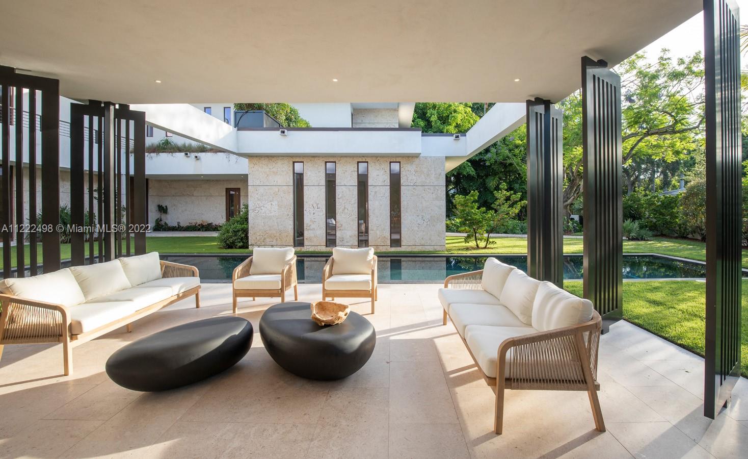 4550 Bay Point Road Miami, FL 33137 - Photo 42 of 92 a outdoor space with patio the couches and dining table with garden view
