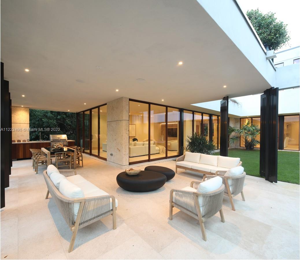 4550 Bay Point Road Miami, FL 33137 - Photo 43 of 92 a living room with patio furniture and a large window