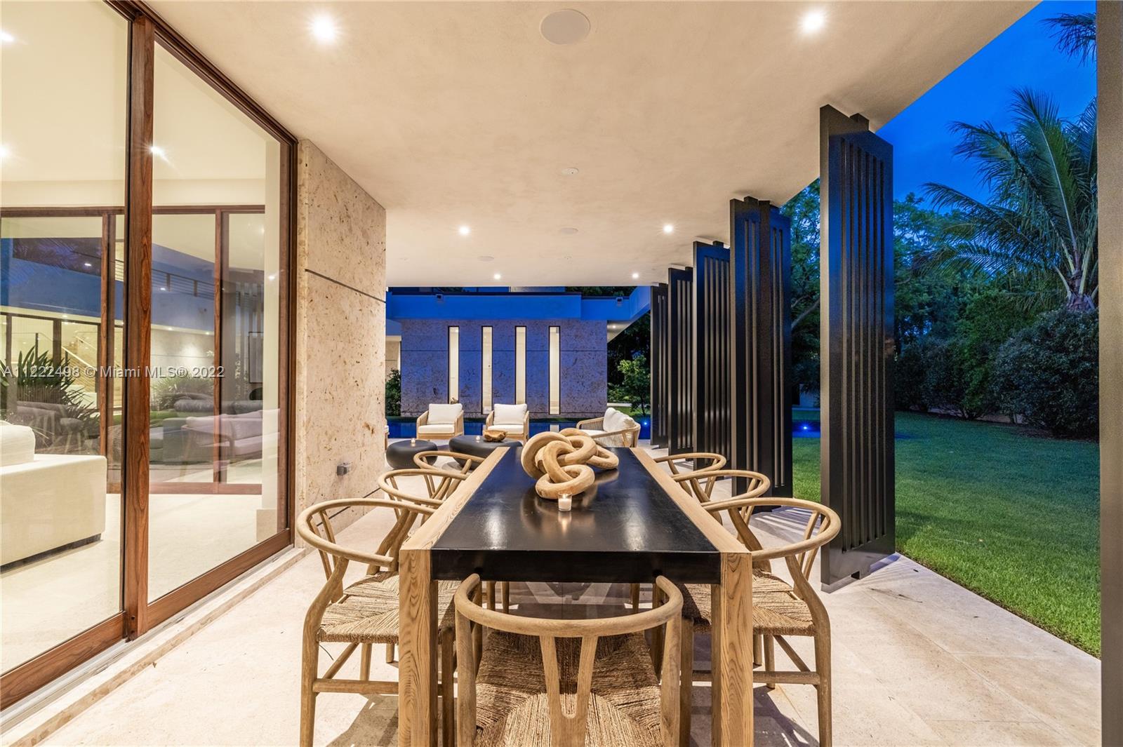 4550 Bay Point Road Miami, FL 33137 - Photo 46 of 92 a table and chairs with the view of garden