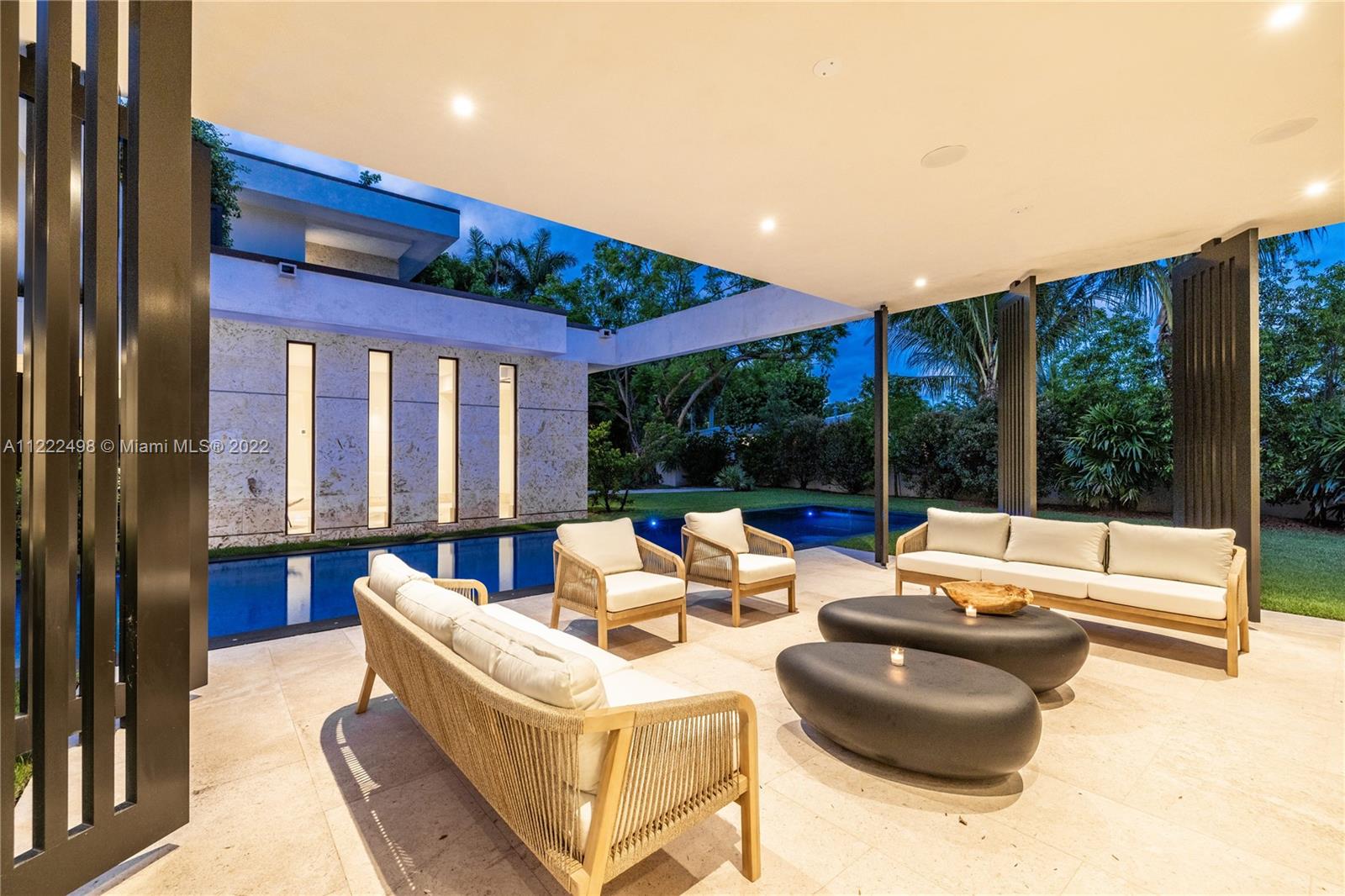 4550 Bay Point Road Miami, FL 33137 - Photo 48 of 92 a living room with furniture and large windows