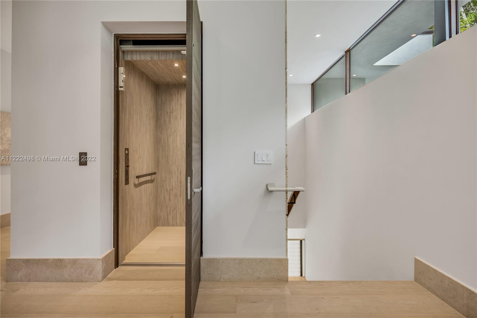 4550 Bay Point Road Miami, FL 33137 - Photo 50 of 92 a view of hallway with stairs