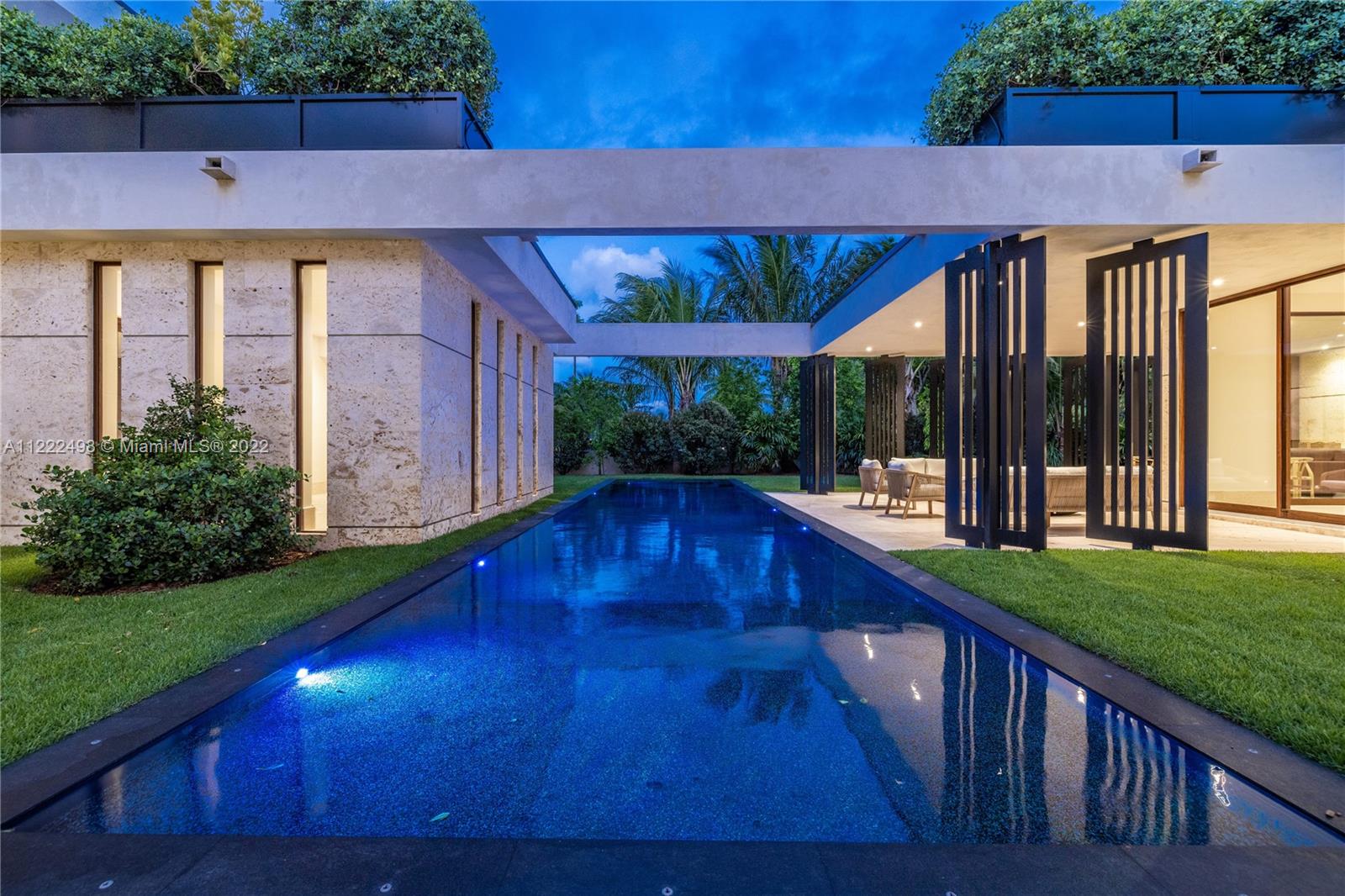 4550 Bay Point Road Miami, FL 33137 - Photo 55 of 92 a balcony with swimming pool table and chairs