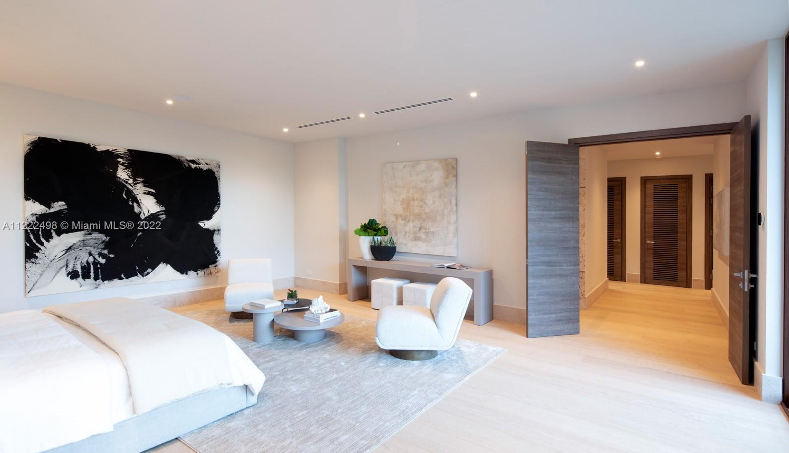 4550 Bay Point Road Miami, FL 33137 - Photo 59 of 92 a bedroom with a bed and a potted plant