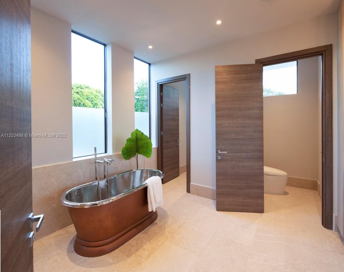 4550 Bay Point Road Miami, FL 33137 - Photo 63 of 92 a living room with furniture and a potted plant