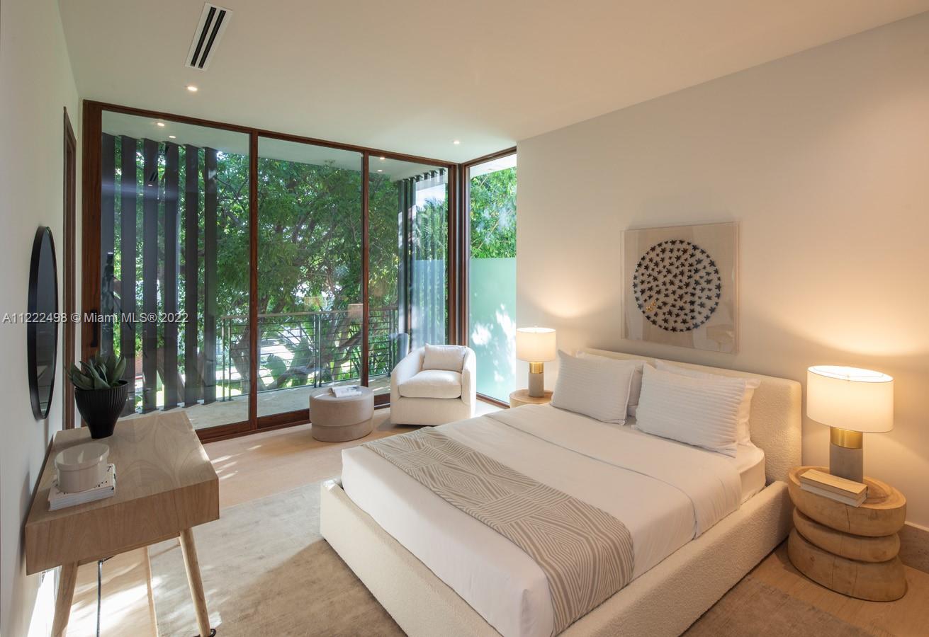 4550 Bay Point Road Miami, FL 33137 - Photo 67 of 92 a bedroom with a bed and glass window