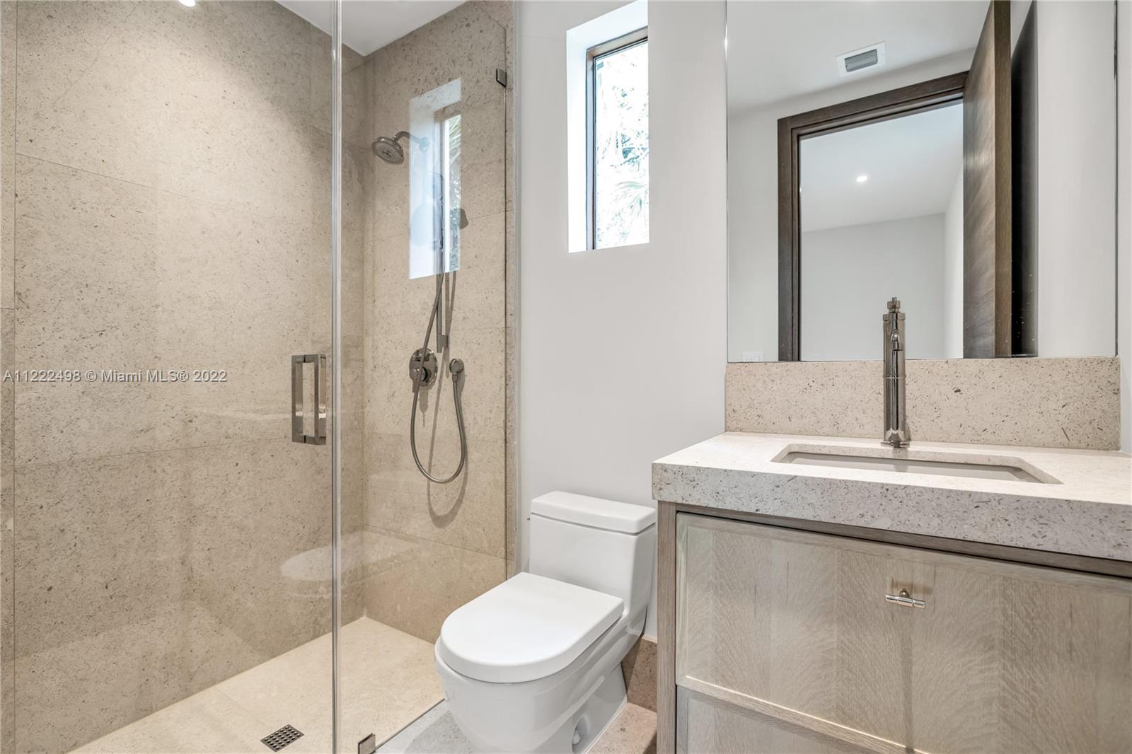 4550 Bay Point Road Miami, FL 33137 - Photo 68 of 92 a bathroom with a granite countertop sink toilet and shower