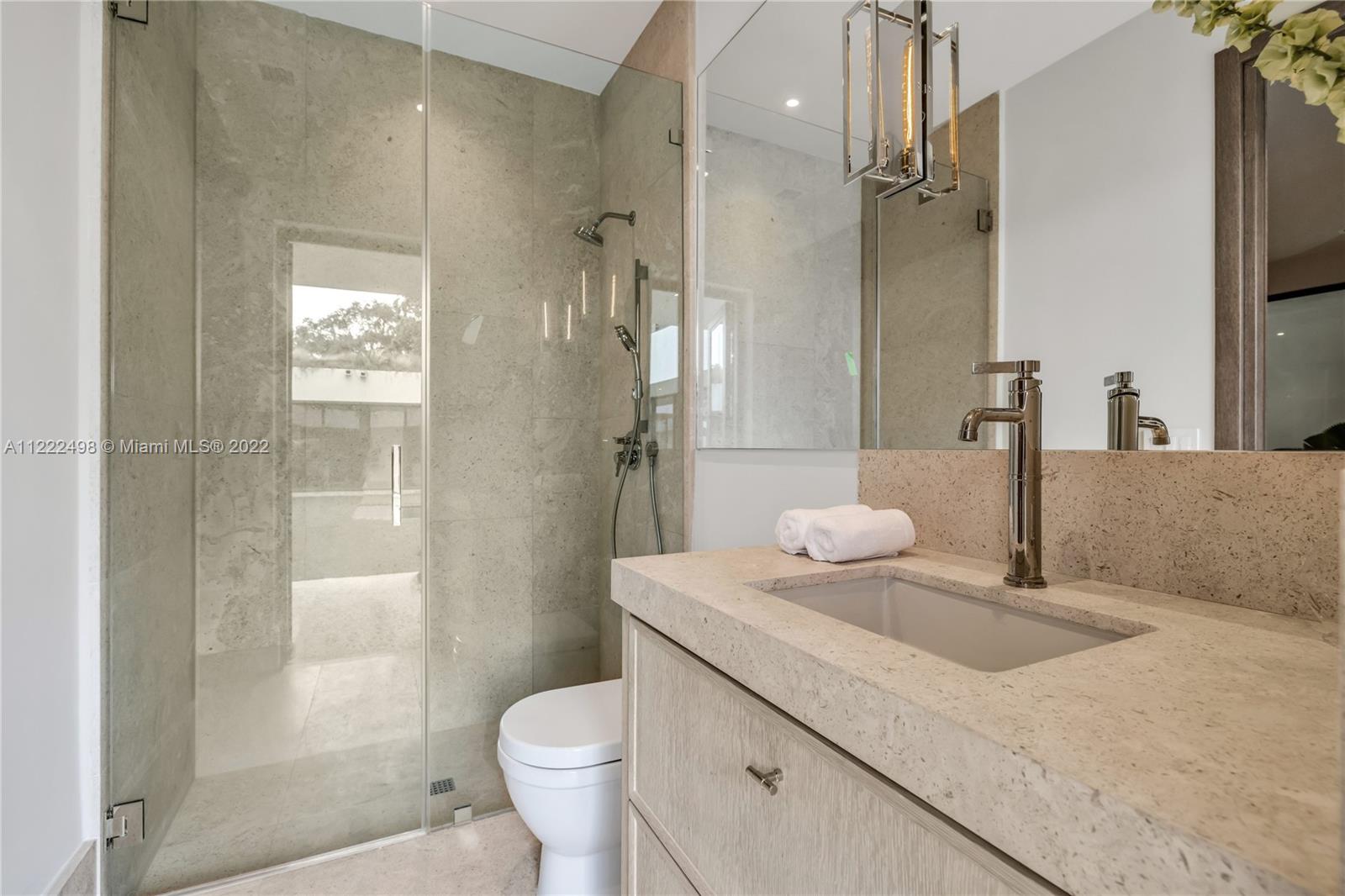 4550 Bay Point Road Miami, FL 33137 - Photo 69 of 92 a bathroom with a sink a toilet and shower