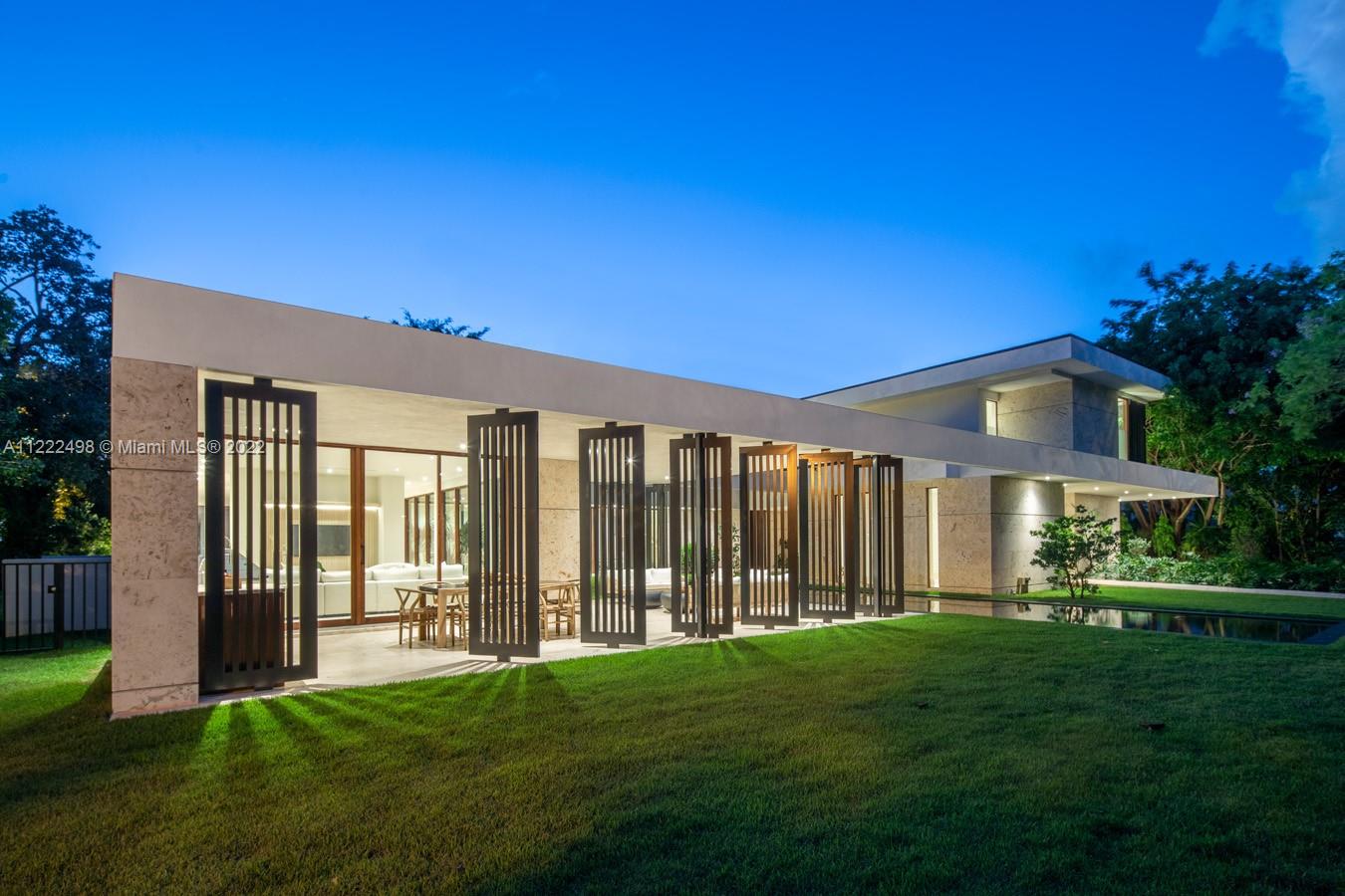 4550 Bay Point Road Miami, FL 33137 - Photo 7 of 92 a front view of a house with a garden