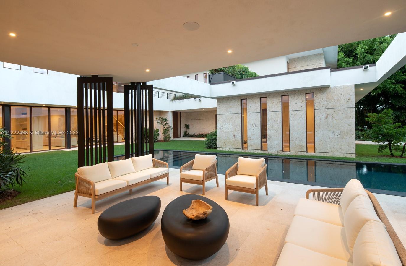 4550 Bay Point Road Miami, FL 33137 - Photo 73 of 92 a balcony with furniture and a garden