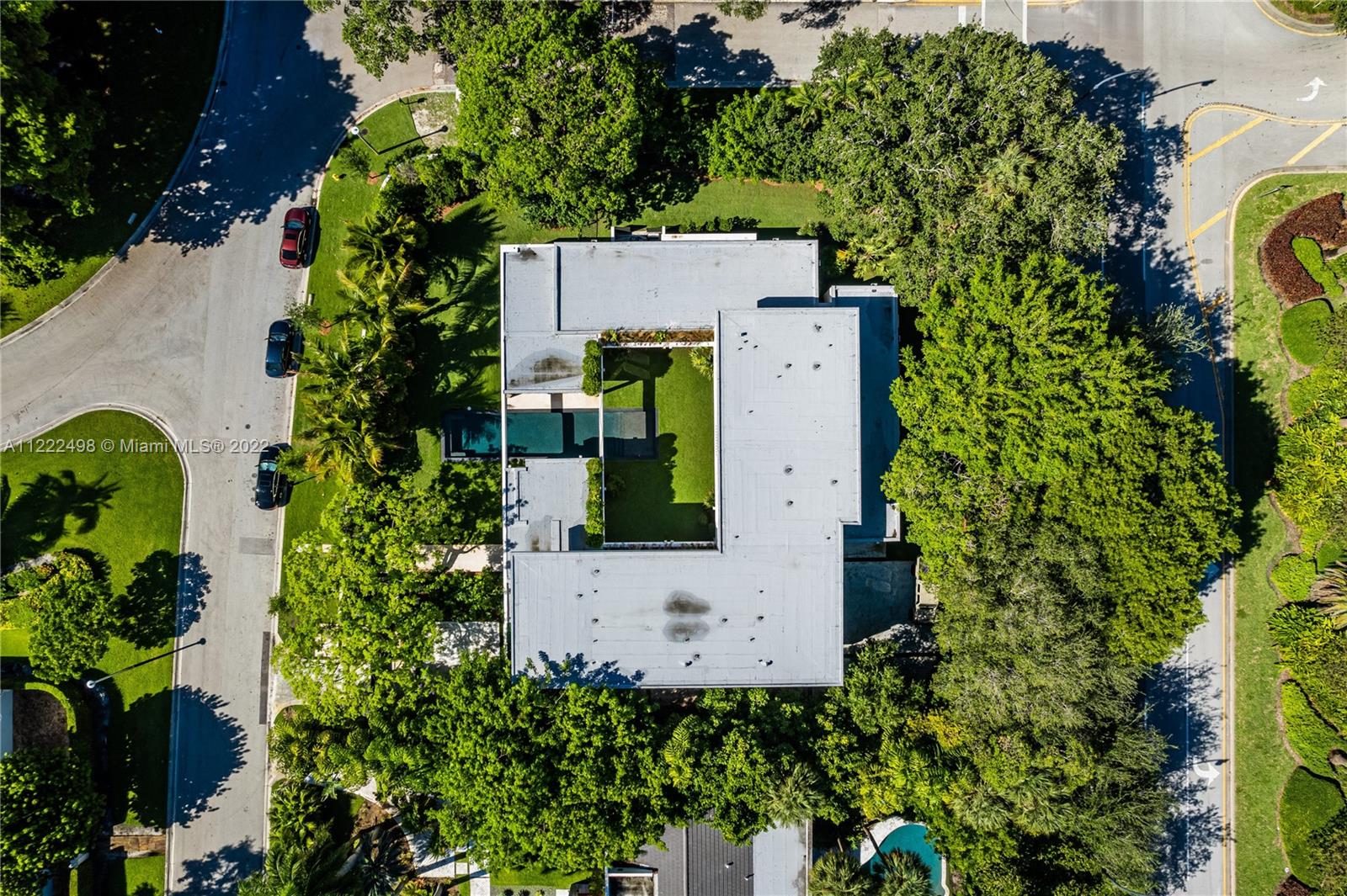 4550 Bay Point Road Miami, FL 33137 - Photo 75 of 92 an aerial view of a house with a garden