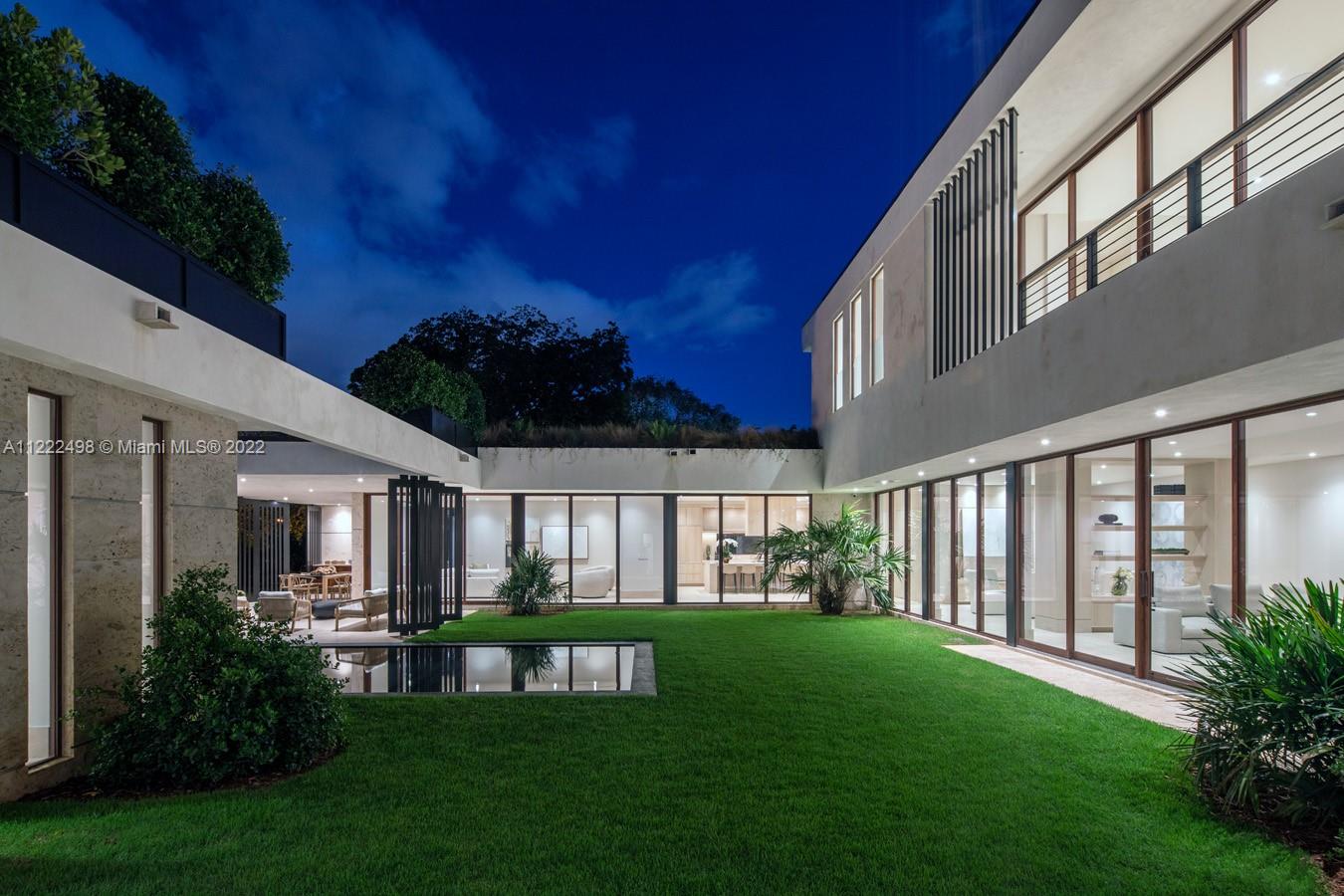 4550 Bay Point Road Miami, FL 33137 - Photo 80 of 92 a garden view with a seating space