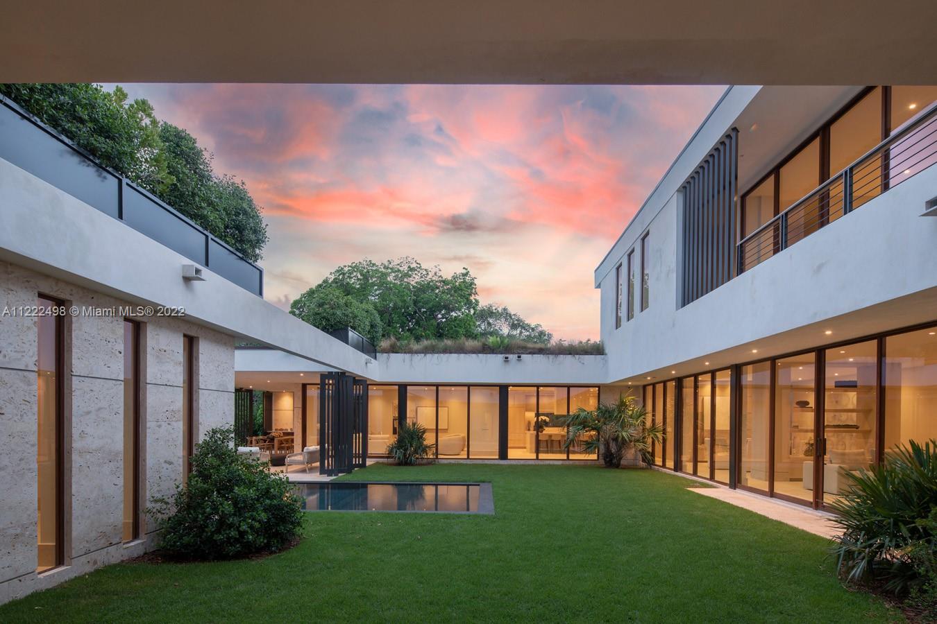 4550 Bay Point Road Miami, FL 33137 - Photo 81 of 92 a front view of a house with garden