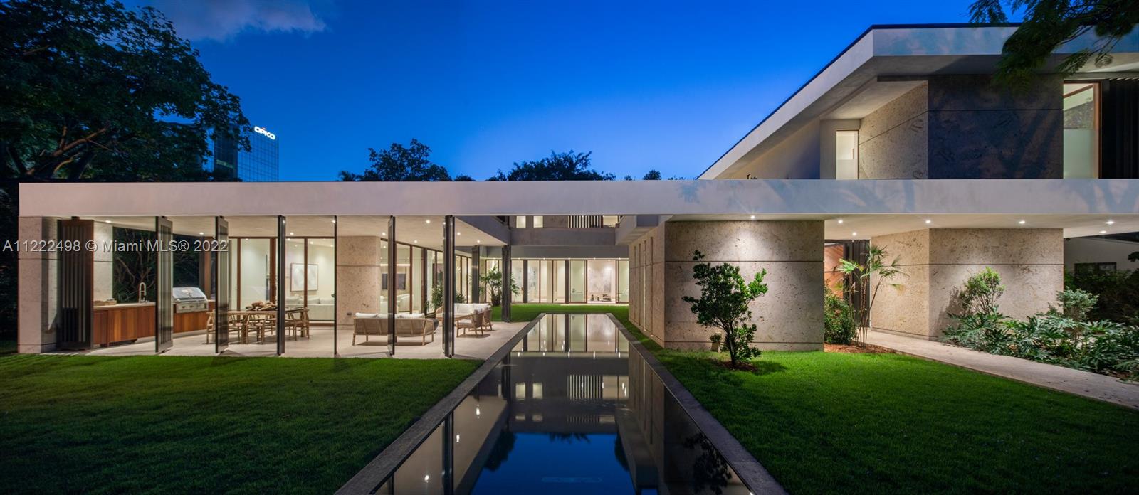 4550 Bay Point Road Miami, FL 33137 - Photo 82 of 92 a view of a house with a yard