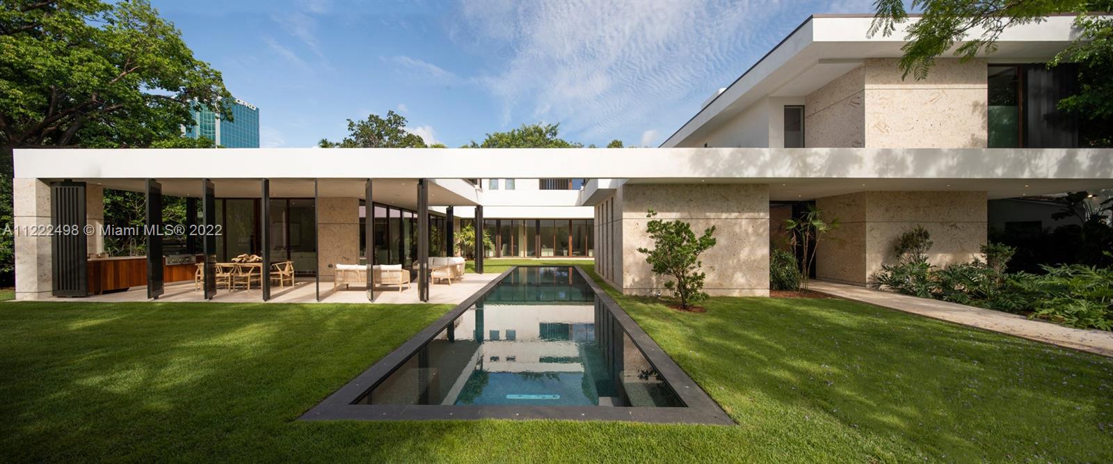 4550 Bay Point Road Miami, FL 33137 - Photo 83 of 92 a view of a house with backyard porch and sitting area