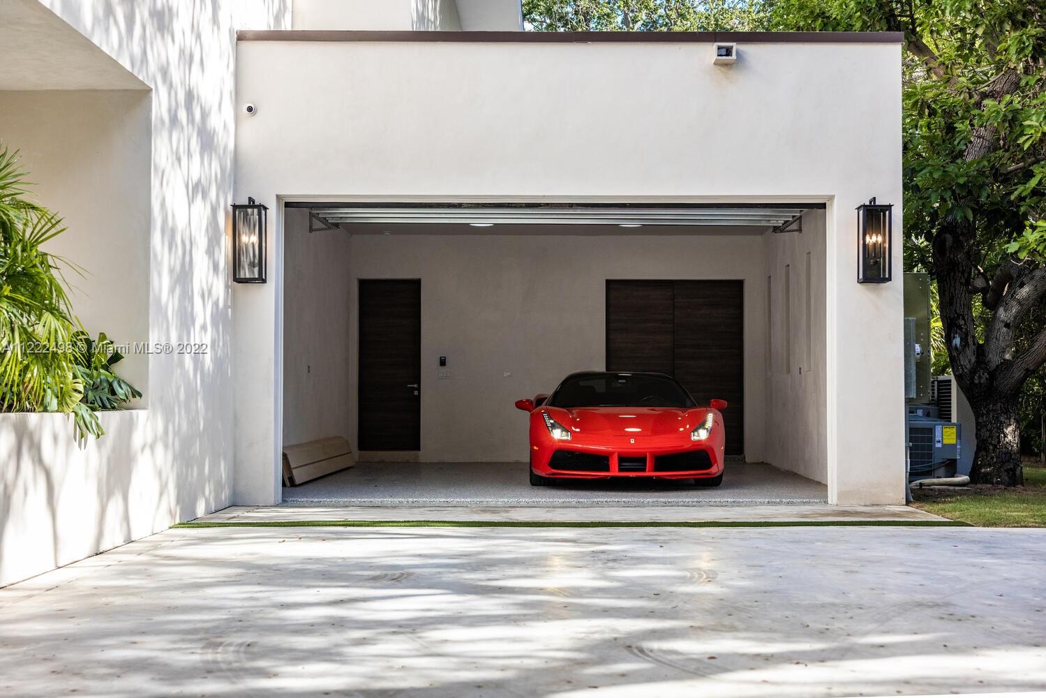 4550 Bay Point Road Miami, FL 33137 - Photo 92 of 92 a car parked in front of a house