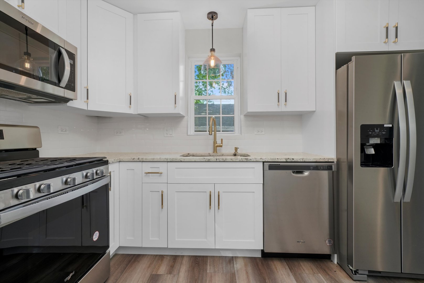 329 East Quincy Street Riverside, IL 60546 - Photo 11 of 39 a kitchen with stainless steel appliances white cabinets and a stove