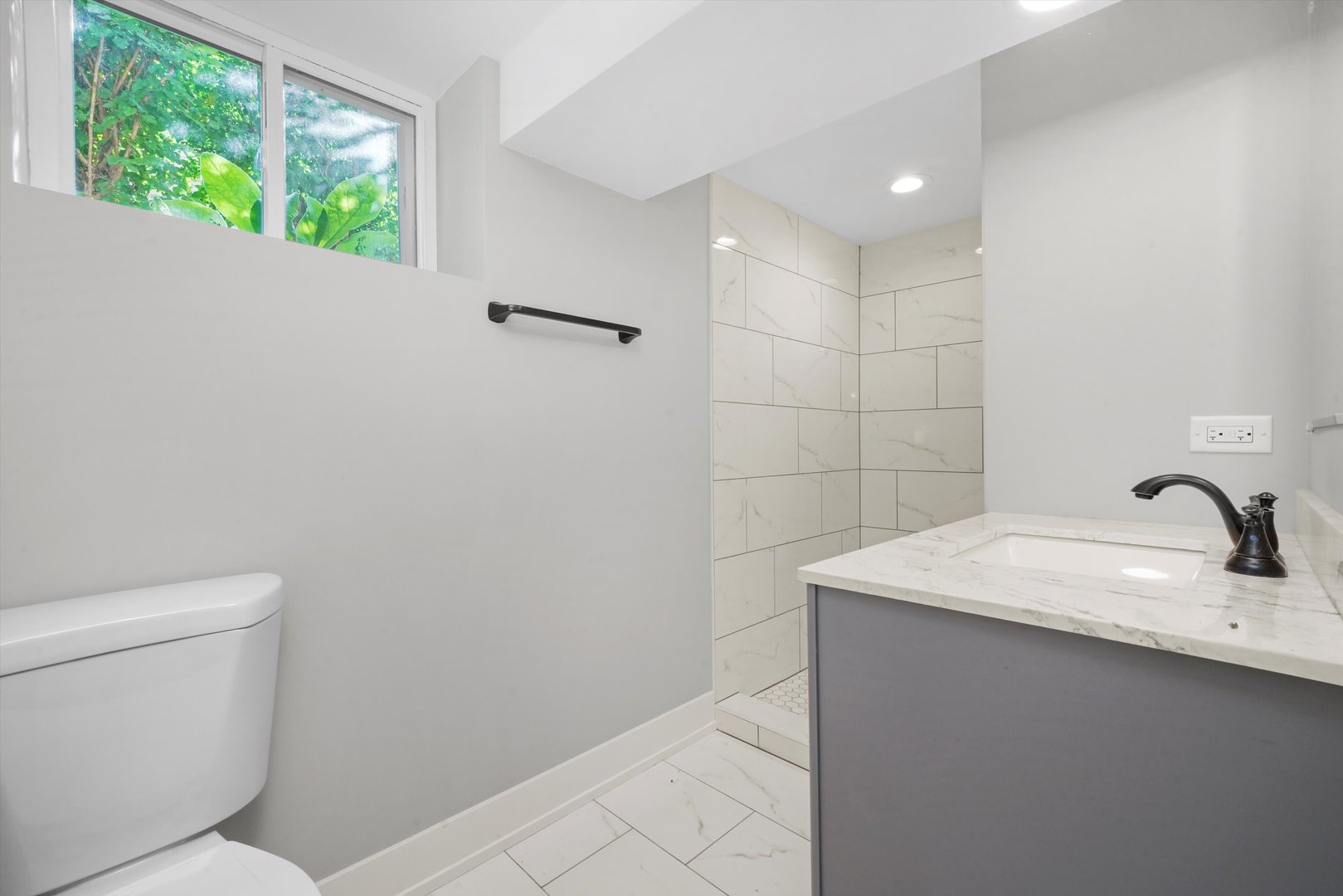 329 East Quincy Street Riverside, IL 60546 - Photo 28 of 39 a bathroom with a sink toilet and window