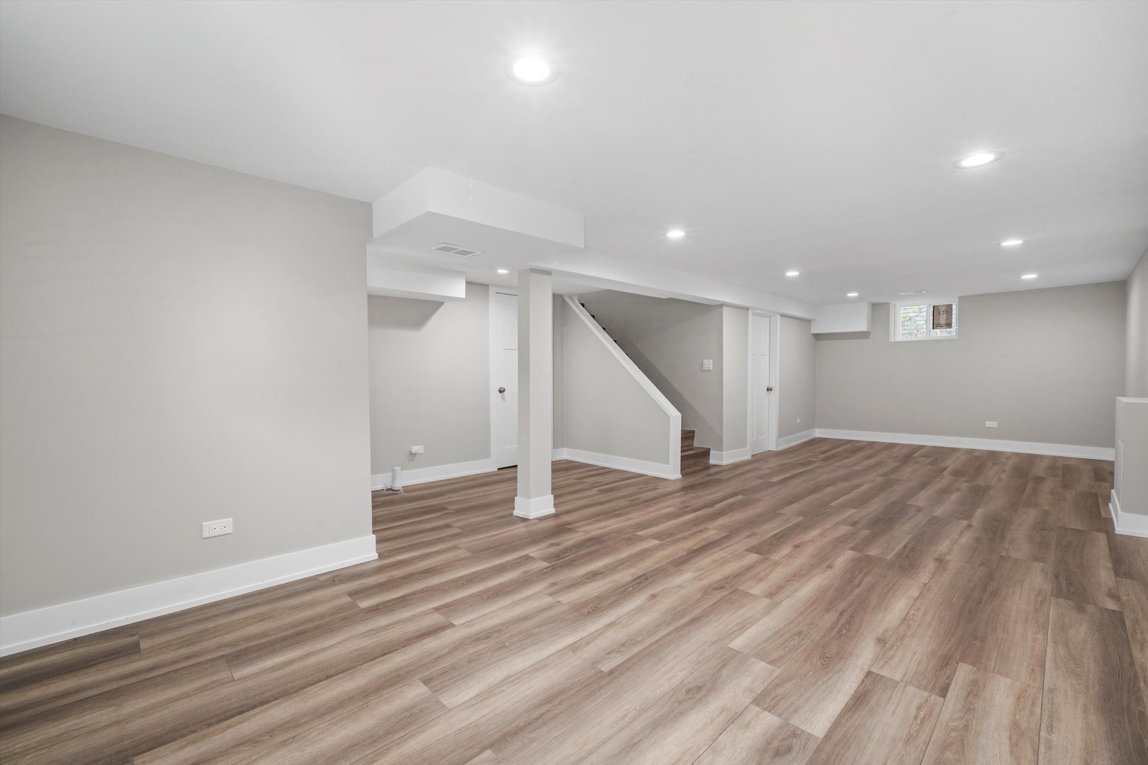 329 East Quincy Street Riverside, IL 60546 - Photo 31 of 39 an empty room with wooden floor and a ceiling fan