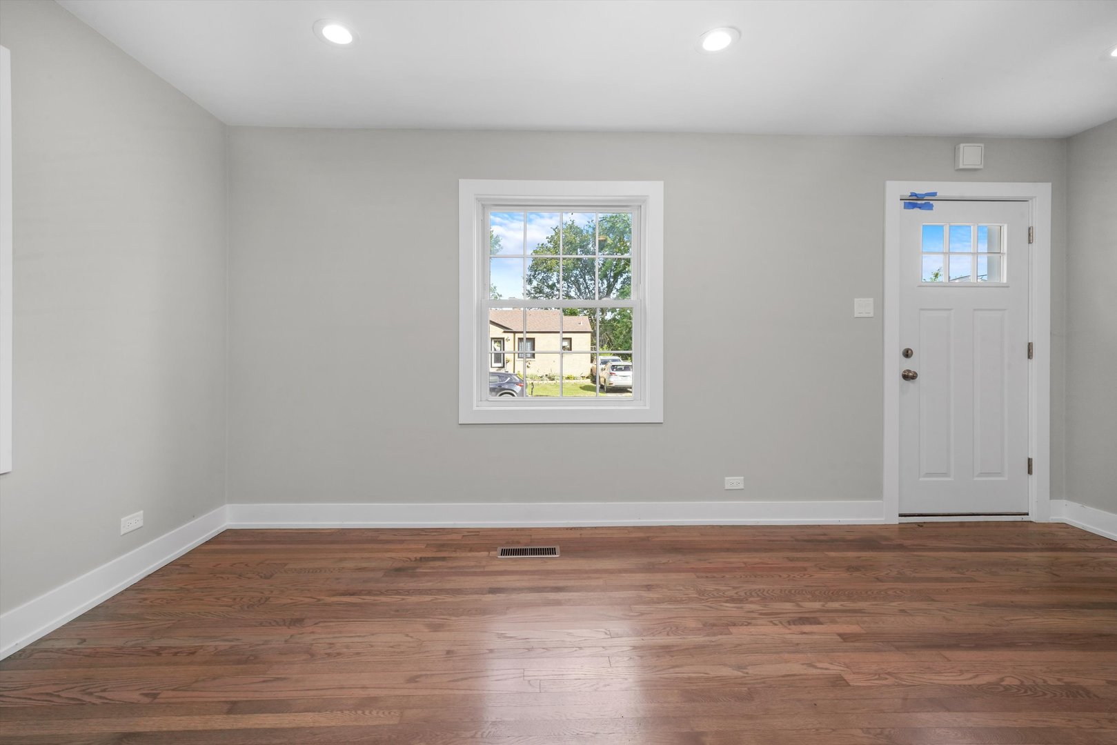 329 East Quincy Street Riverside, IL 60546 - Photo 5 of 39 a view of room with window and wooden floor