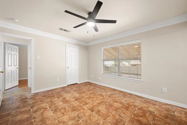 a view of an empty room with a window