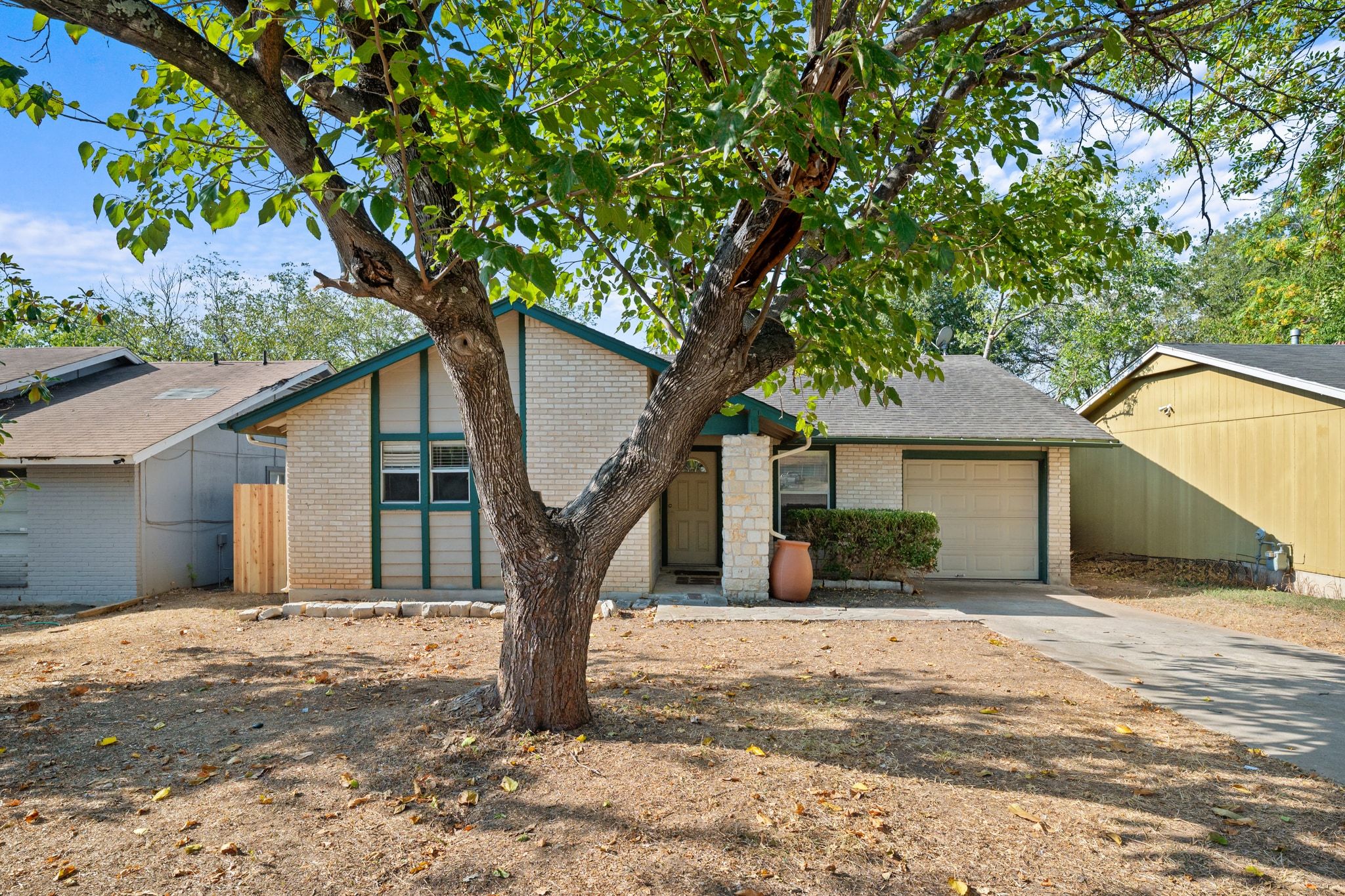 2321 Bendridge Trail Austin, TX 78744 - Photo 5 of 27 a house with a tree in front of it