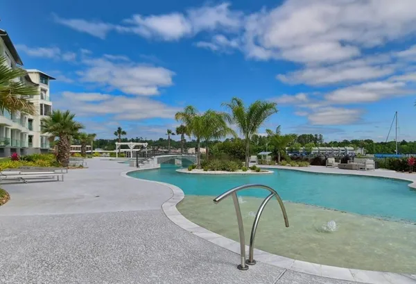 a view of a swimming pool in a backyard