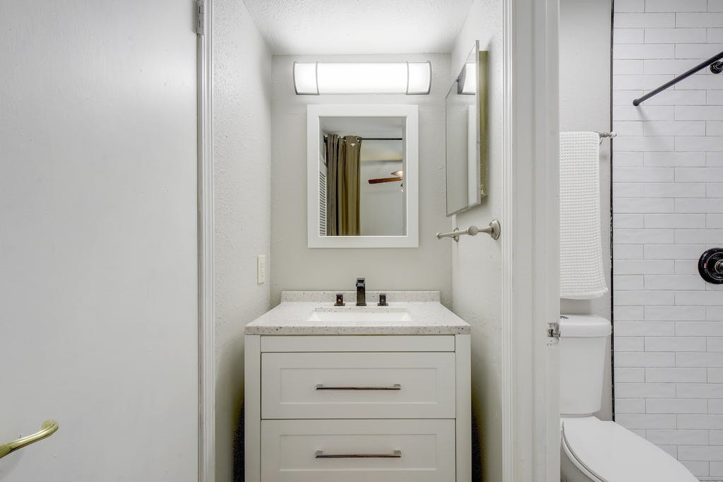 1111 West 10th Street, Unit 106 Austin, TX 78703 - Photo 15 of 21 Bathroom sink and vanity in hall
