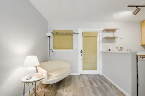 a bathroom with a sink mirror and toilet