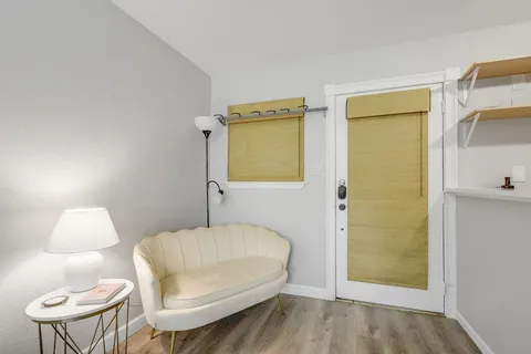 a bedroom with a bed and a chair