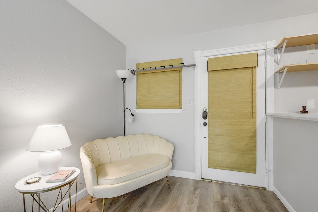 1111 West 10th Street, Unit 106 Austin, TX 78703 - Photo 5 of 21 Door and living area, kitchen area to right