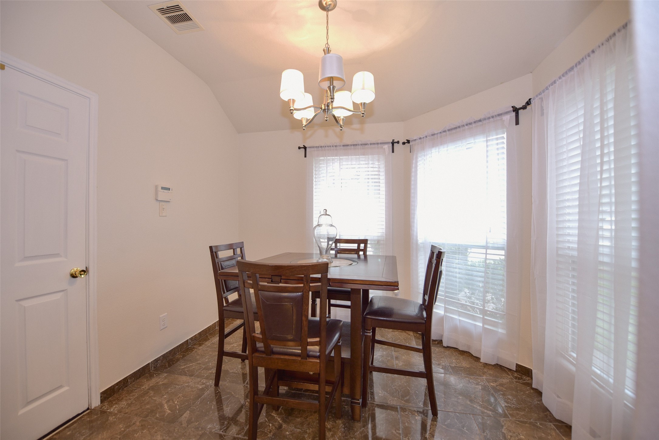 2719 Magnolia Hill Trail Houston, TX 77038 - Photo 23 of 28 a view of a dining room with furniture window and wooden floor