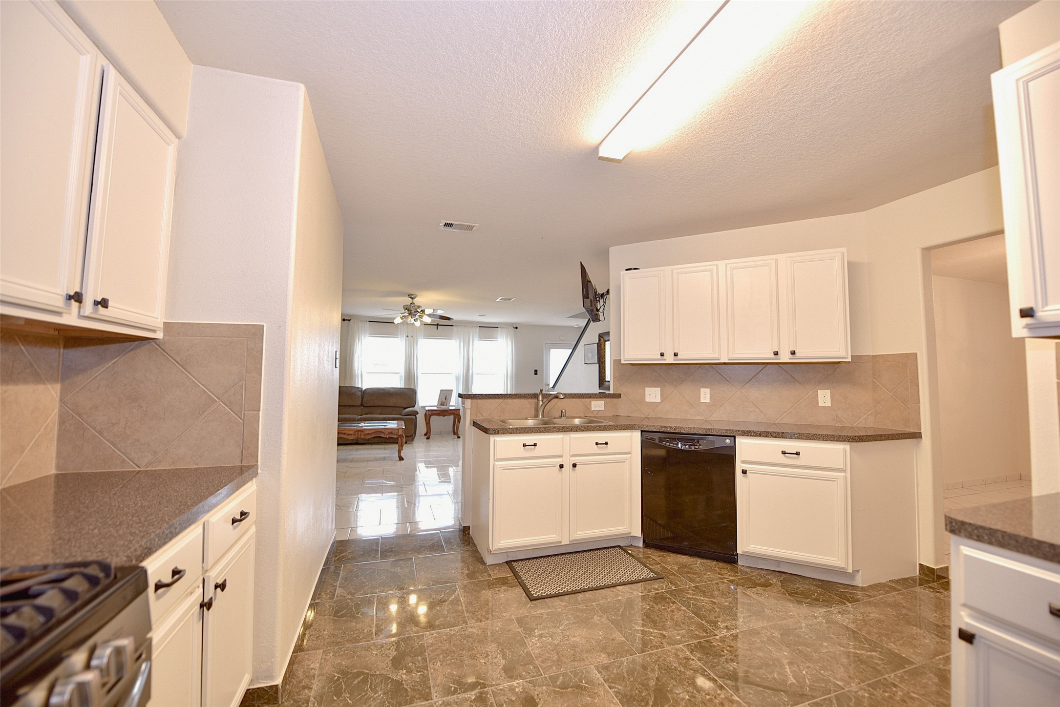 2719 Magnolia Hill Trail Houston, TX 77038 - Photo 26 of 28 a large kitchen with stainless steel appliances granite countertop a sink and cabinets
