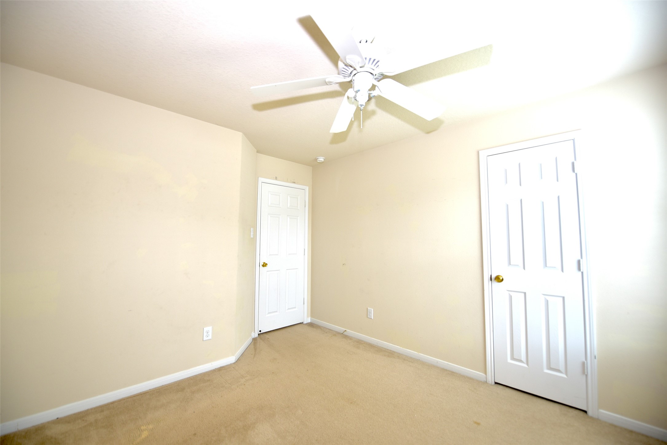 2719 Magnolia Hill Trail Houston, TX 77038 - Photo 6 of 28 an empty room with windows and fan