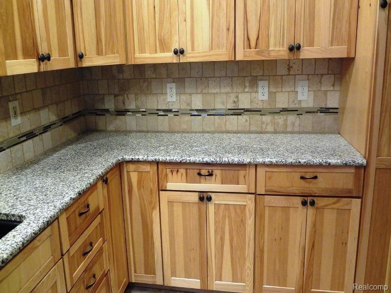 1100 Cove Road Goodells, MI 48027 - Photo 8 of 16 Kitchen Cabinets-tile.jpg