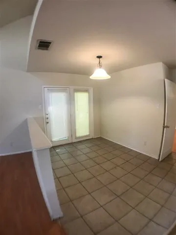 a view of an empty room and window