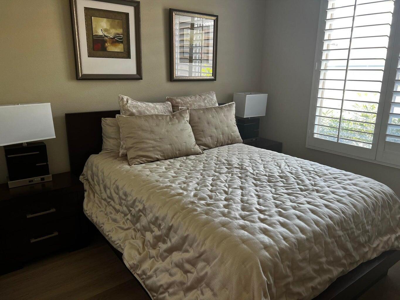 44725 Alexandria Vale Indio, CA 92201 - Photo 14 of 22 a large bed sitting in a bedroom next to a window