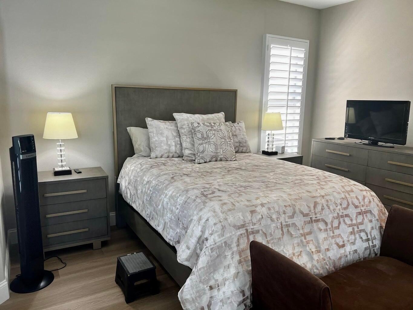 44725 Alexandria Vale Indio, CA 92201 - Photo 20 of 22 a bedroom with a bed and a flat screen tv