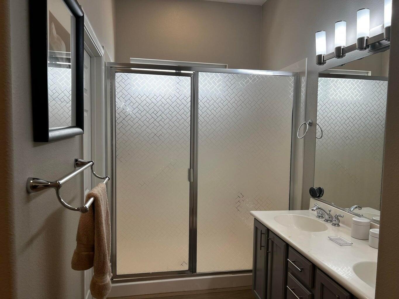 44725 Alexandria Vale Indio, CA 92201 - Photo 22 of 22 a bathroom with a granite countertop sink mirror and shower