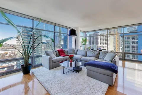 a living room with furniture and a large window