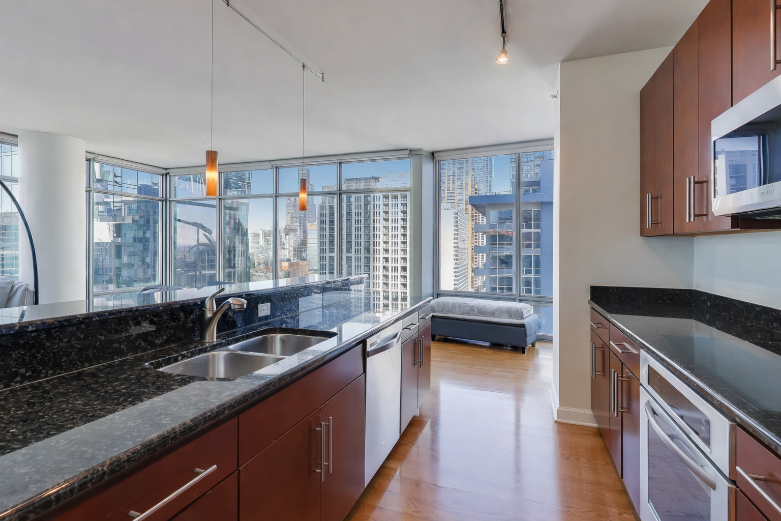 100 East 14th Street, Unit 2010 Chicago, IL 60605 - Photo 7 of 30 a kitchen that has a sink and a stove