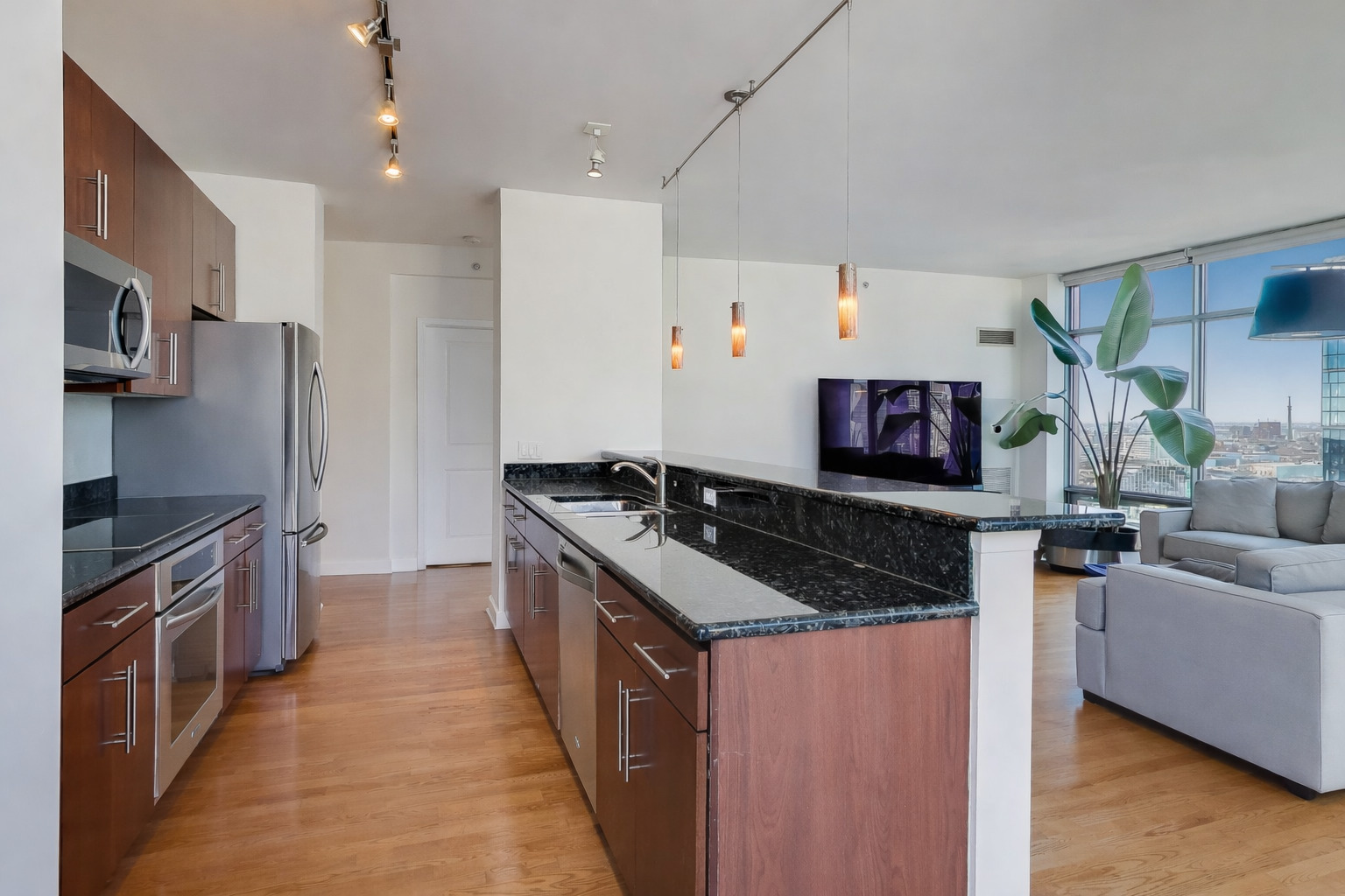 100 East 14th Street, Unit 2010 Chicago, IL 60605 - Photo 8 of 30 a kitchen with stainless steel appliances granite countertop a stove and a refrigerator