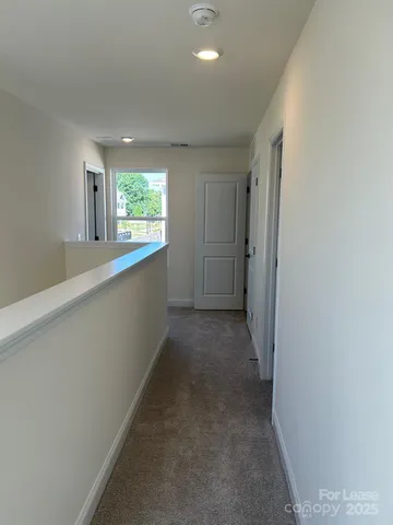 a view of a kitchen with a sink and window