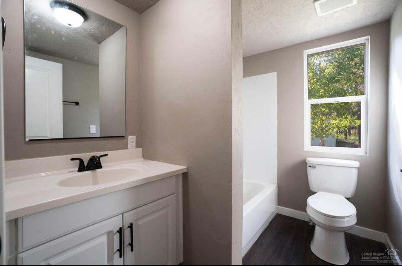 17317 Jacinto Road Bend, OR 97707 - Photo 16 of 25 a bathroom with a sink toilet and mirror